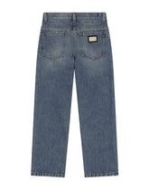 5-pocket treated denim jeans with logo appliqué and the logo tag - | Dolce & Gabbana