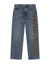 5-pocket treated denim jeans with logo appliqué and the logo tag - | Dolce & Gabbana