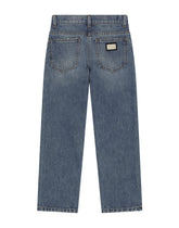 5-pocket treated denim jeans with logo appliqué and the logo tag - | Dolce & Gabbana