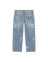 Washed denim jeans with abrasions - | Dolce & Gabbana