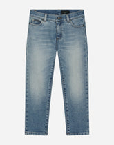 5-pocket treated stretch denim jeans with logo print - | Dolce & Gabbana