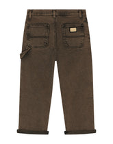 Treated denim jeans with logo tag - | Dolce & Gabbana