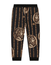 Cotton jogging pants with all-over coin print - | Dolce & Gabbana