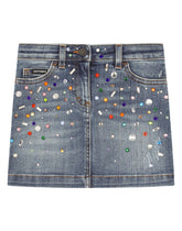 Short denim skirt with multi-colored fusible rhinestones - | Dolce & Gabbana