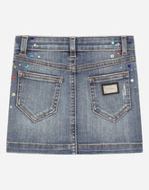 Short denim skirt with multi-colored fusible rhinestones - | Dolce & Gabbana