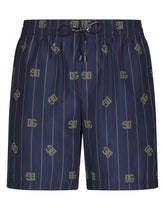 Mid-length swim trunks with DG Monogram print - | Dolce & Gabbana