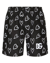 Mid-length swim trunks with DG heart print - | Dolce & Gabbana