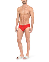 Swim briefs with high-cut leg and branded plate - | Dolce & Gabbana