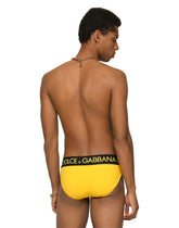 Swim briefs with high-cut leg and branded rear waistband - | Dolce & Gabbana