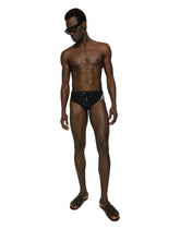 Swim briefs with high-cut leg and branded band - | Dolce & Gabbana
