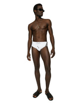 Swim briefs with high-cut leg and branded band - | Dolce & Gabbana