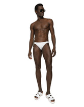 Swim briefs with logo plate and coin charm - | Dolce & Gabbana