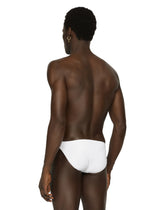 Swim briefs with logo plate and coin charm - | Dolce & Gabbana