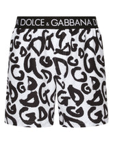 Mid-length swim trunks with all-over DG logo print - | Dolce & Gabbana