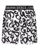 Mid-length swim trunks with all-over DG logo print - | Dolce & Gabbana