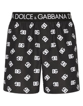 Mid-length swim trunks with all-over DG logo print - | Dolce & Gabbana
