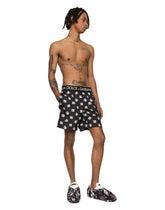 Mid-length swim trunks with all-over DG logo print - | Dolce & Gabbana