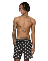 Mid-length swim trunks with all-over DG logo print - | Dolce & Gabbana