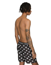 Mid-length swim trunks with all-over DG logo print - | Dolce & Gabbana