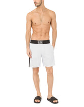 Two-tone mid-length swim trunks with DG patch - | Dolce & Gabbana