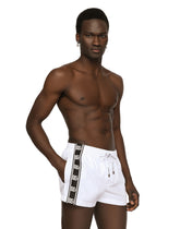 Short swim trunks with DG logo band - | Dolce & Gabbana
