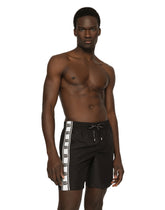 Mid-length swim trunks with DG logo band - | Dolce & Gabbana