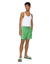 Mid-length swim trunks with DG logo band - | Dolce & Gabbana