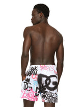 Mid-length swim trunks with spray-paint graffiti print - | Dolce & Gabbana
