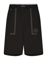 Long swim trunks with DG logo band - | Dolce & Gabbana