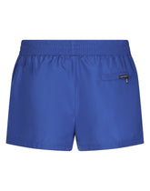 Short swim trunks with embossed DG logo - | Dolce & Gabbana