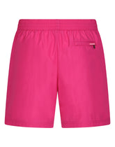 Mid-length swim trunks with embossed DG logo - | Dolce & Gabbana