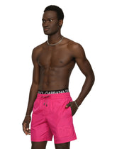 Mid-length swim trunks with embossed DG logo - | Dolce & Gabbana
