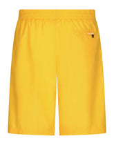 Long-leg swim trunks with embossed DG logo - | Dolce & Gabbana