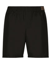 Mid-length swim trunks with logo tag - | Dolce & Gabbana