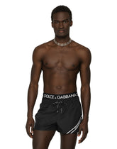 Short swim trunks with branded band - | Dolce & Gabbana