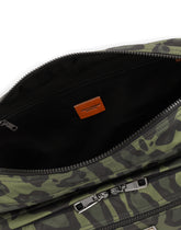 Nylon messenger bag with a leopard print against a green background and branded plate -  | Dolce & Gabbana