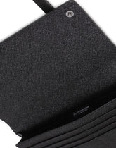 Dauphine calfskin wallet with shoulder strap and leopard print against a gray background -  | Dolce & Gabbana