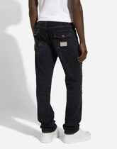 Regular blue denim jeans with abrasions and rips -  | Dolce &amp; Gabbana