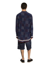 Blue denim shorts with abrasions -  | Dolce & Gabbana