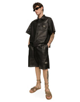 Openwork leather Bermuda jogging pants with brand plate -  | Dolce & Gabbana