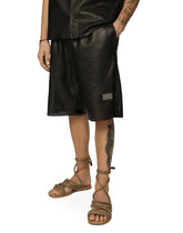 Openwork leather Bermuda jogging pants with brand plate -  | Dolce & Gabbana