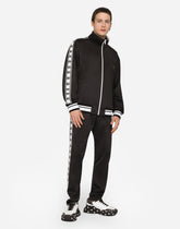 Jogging pants with DG logo and bands -  | Dolce &amp; Gabbana