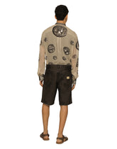 Washed denim Bermuda shorts with rips -  | Dolce & Gabbana