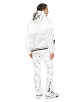 Slim-fit stretch jeans with rips and splash design -  | Dolce & Gabbana