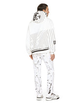 Slim-fit stretch jeans with rips and splash design -  | Dolce & Gabbana