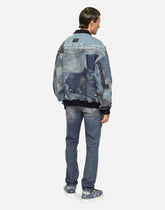 Light blue slim-fit stretch jeans with abrasions -  | Dolce & Gabbana