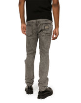 Light gray slim-fit stretch jeans with rips -  | Dolce & Gabbana