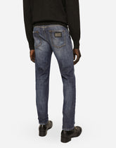 Slim fit washed stretch jeans with subtle abrasions -  | Dolce & Gabbana