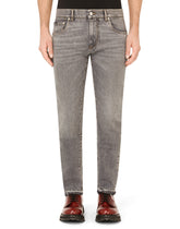 Light blue skinny stretch jeans with frayed turn-ups -  | Dolce & Gabbana