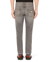 Light blue skinny stretch jeans with frayed turn-ups -  | Dolce & Gabbana